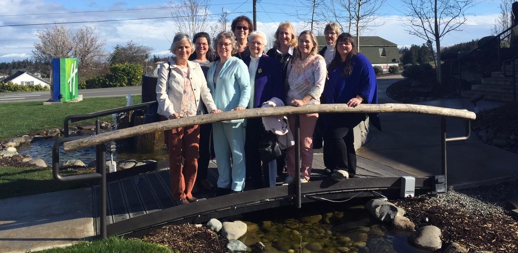 A few of the women stop on the bridge after enjoying dinner